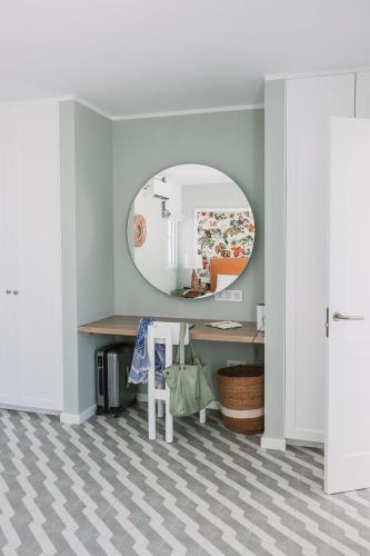 a room with a mirror and a desk with a table at Sierra del Mar in Playa del Ingles