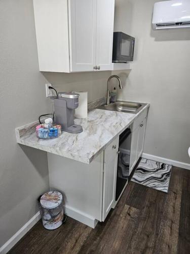 a kitchen with a sink and a counter top at Cocoa Corner in Cleveland