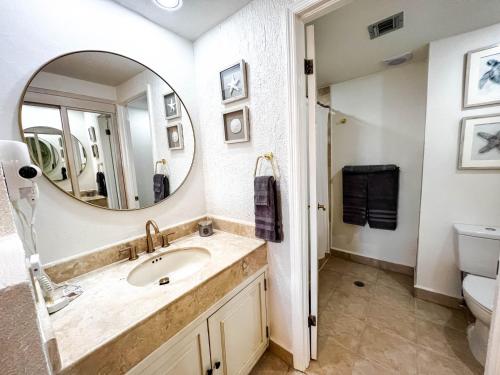 a bathroom with a sink and a mirror at Princesa de Peñasco Condo D203 Sandy Beach Puerto Peñasco in Puerto Peñasco
