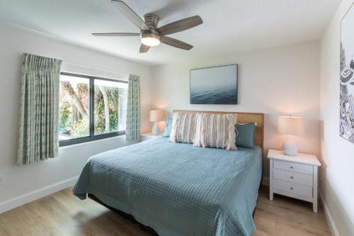 a bedroom with a bed and a ceiling fan at 400 South in Cocoa Beach