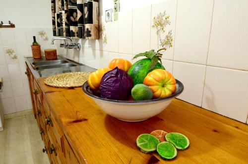 a bowl of fruit on a counter in a kitchen at Golden Apartments in Agios Nikolaos