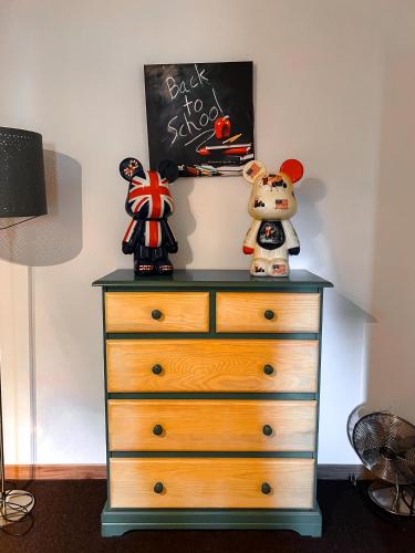 a dresser with a chalkboard on top of it at Mas des Vignes in Sainte-Cécile-les-Vignes