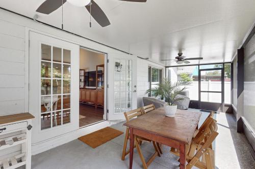 a dining room with a wooden table and chairs at Bayside Bungalow in Tampa