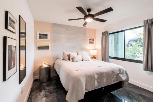a bedroom with a bed with a ceiling fan at 400 South in Cocoa Beach