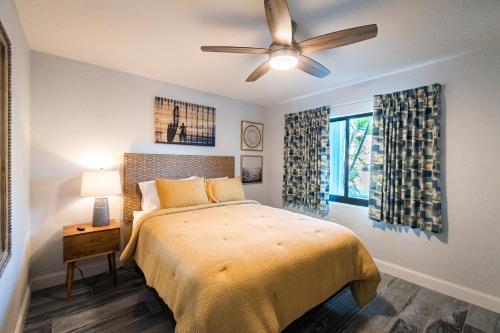 a bedroom with a bed and a ceiling fan at 400 South in Cocoa Beach