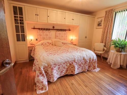 En eller flere senge i et værelse på Stonegarth Cottage