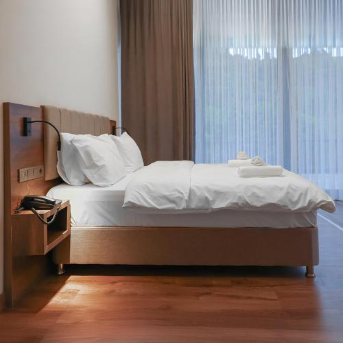 Ένα ή περισσότερα κρεβάτια σε δωμάτιο στο Querencia Suit Hotel