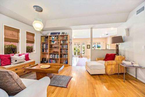a living room with a couch and a table at House on the canal in Venice in Los Angeles
