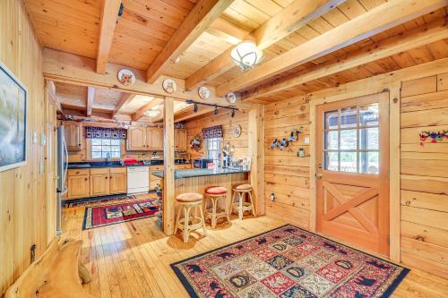 a kitchen with wooden walls and a wooden ceiling at Near Bushkill Falls Pocono Mountains Cabin! in Bushkill
