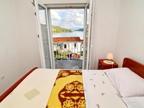 Ένα ή περισσότερα κρεβάτια σε δωμάτιο στο Apartments Nodilo - One Bedroom Apartment with Balcony and Sea View Apt 1