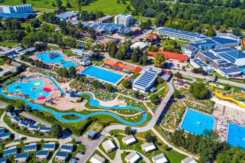 an aerial view of a resort with many pools at Cozzy cottage near Ljubljana in Višnja Gora