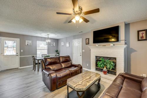 a living room with a couch and a fireplace at Mabelvale Home with Grill 12 Mi to Little Rock! in Mabelvale