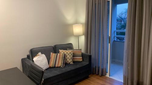 Flat confortável próx Ibirapuera e Jardins com garagem的休息区