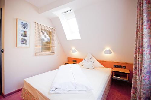 Postel nebo postele na pokoji v ubytování Hotel Lehmeier