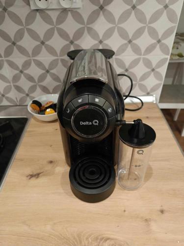 a coffee maker sitting on top of a table at apartament 30 m2 FOR YOU in Szczawno-Zdrój