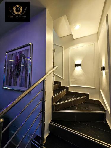 a staircase in a building with purple walls at 2 Bed Apartment 3 - Bright Benin City Stay in Benin City