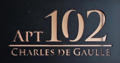 a sign that reads art charities de gaille at 2 Bed Apartment 2 - Cosy Benin City Escape in Benin City