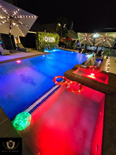 a swimming pool with red and blue lights at 2 Bed Apartment 8 - Modern Benin City Residence in Benin City