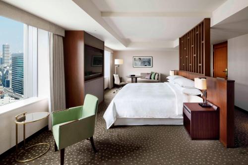 a hotel room with a bed and a large window at Yokohama Bay Sheraton Hotel and Towers in Yokohama