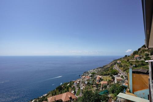 a view of a town on a hill next to the ocean at Furore house of Benedetta in Furore