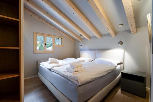 Ένα ή περισσότερα κρεβάτια σε δωμάτιο στο New Penthouse Surlej Sankt Moritz