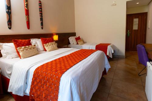 Кровать или кровати в номере Kalango Hotel Boutique