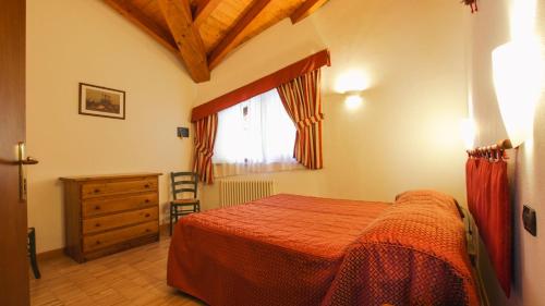 Postel nebo postele na pokoji v ubytování Residence Les Nigritelles