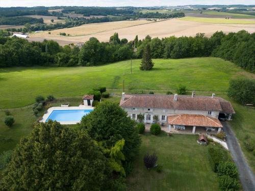 an aerial view of a house with a swimming pool at Le Boisdalon in Yviers
