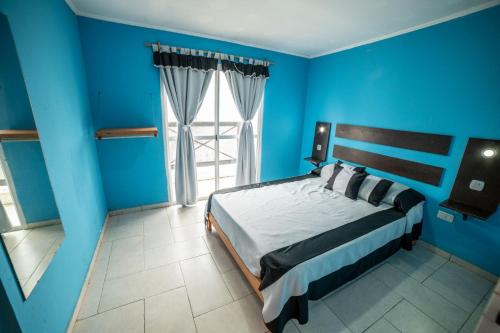 Postel nebo postele na pokoji v ubytování Palmeras Departamentos