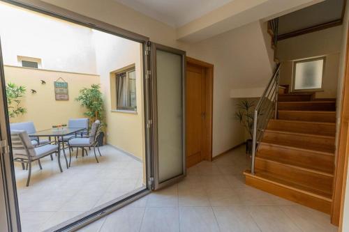 a living room with a table and a dining room at Casa da Vila in Ribeira de Pena