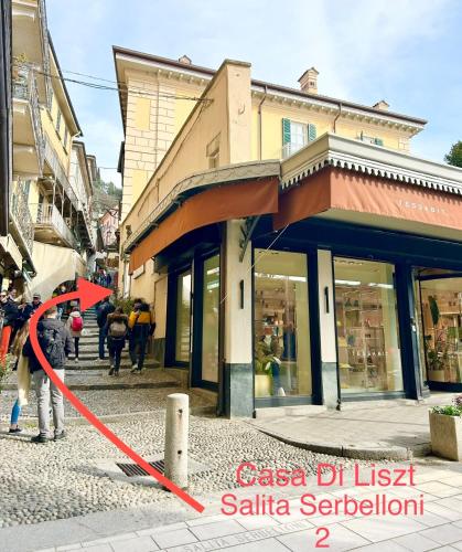 a person is standing in front of a building at Liszt Tower by KlabHouse in Bellagio