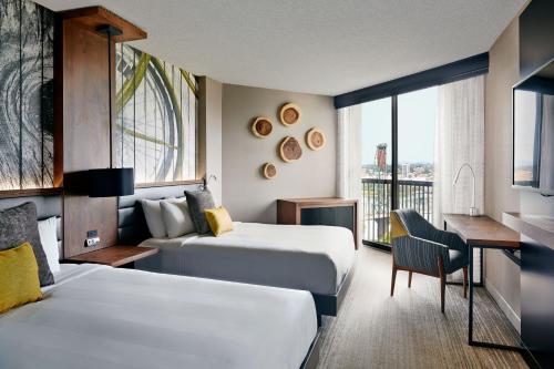 a hotel room with two beds and a desk at Portland Marriott Downtown Waterfront in Portland