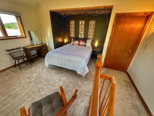 a bedroom with a bed and a table and chairs at Brittany Motel in Sunderland