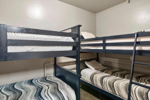 a bunk bed room with two bunk beds at Sunrise Resort Room #106 in Garden City