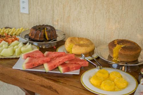 a table topped with different types of food on plates at Villa Coco Beach Preá in Prea