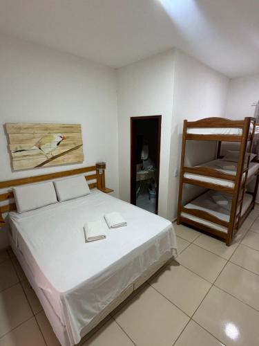 a bedroom with a bed and a bunk ladder at Villa Coco Beach Preá in Prea