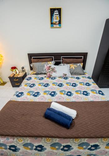 a bed with two towels sitting on top of it at tourist Family and couple private Rooms ME11 BGR 01 baith al jannah LLC one private room in three bedroom apartment in Abu Dhabi