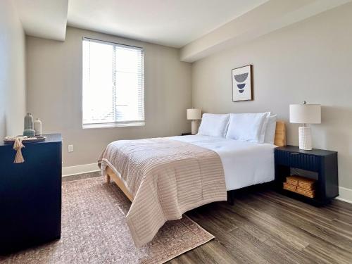 a bedroom with a large bed and a window at Stunning 2BD 2BTH Apt in Santa Monica! in Los Angeles