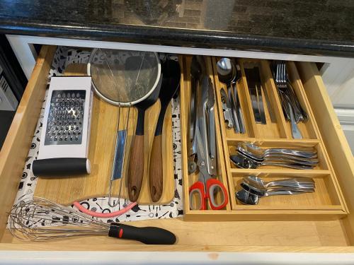 a drawer filled with lots of kitchen utensils at NEW cozy beautiful house with pool and hot tub in Fair Oaks