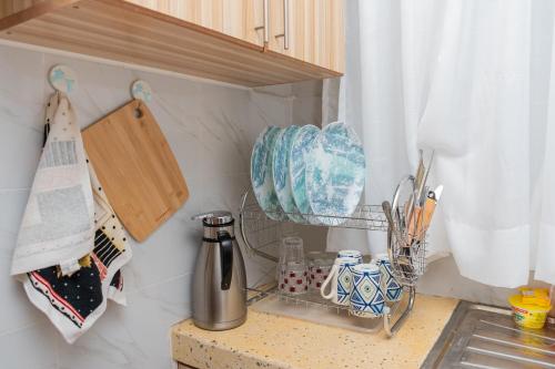 a kitchen counter with a coffee maker on it at Golden Nest in Lake View Estate