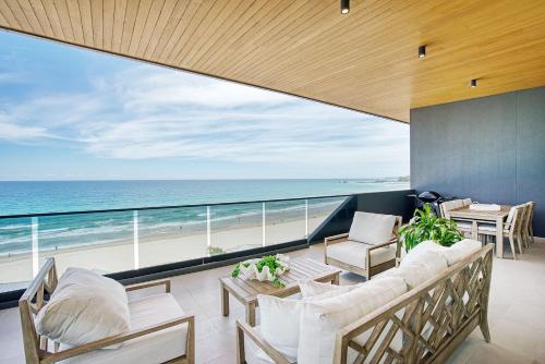 a living room with a view of the ocean at Sable Penthouse at Palm Beach's Waterfront in Gold Coast