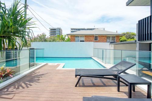 a swimming pool on the roof of a house at Sable Penthouse at Palm Beach's Waterfront in Gold Coast