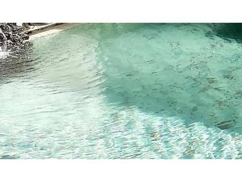 a pool of water with a reflection in the water at Onsen Hotel Tsutsujiso - Vacation STAY 03252v in Kitami