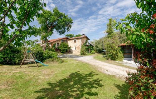 a yard with a house and a playground at Stunning Home In Ossages in Ossages