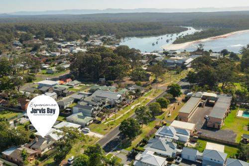 an aerial view of townsville city with a white sign at Kingston Cottage by Experience Jervis Bay in Huskisson