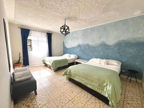 Postel nebo postele na pokoji v ubytování Lool Beh Hostal