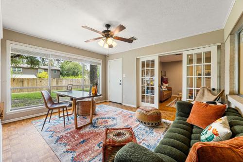 a living room with a couch and a table at Spring nights, Fire Pit, BBQ, Games & Pet-Friendly in College Station
