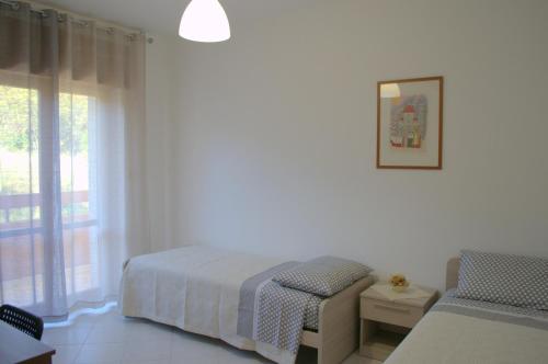 Postel nebo postele na pokoji v ubytování Casa Vacanze La Rocca