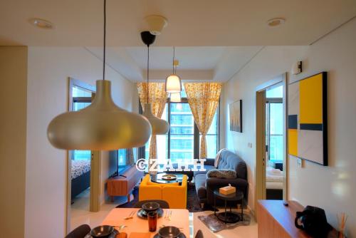 a living room with a couch and a table at Business Bay Retreat in Dubai
