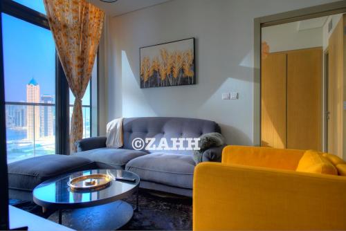 a living room with a couch and a table at Business Bay Retreat in Dubai